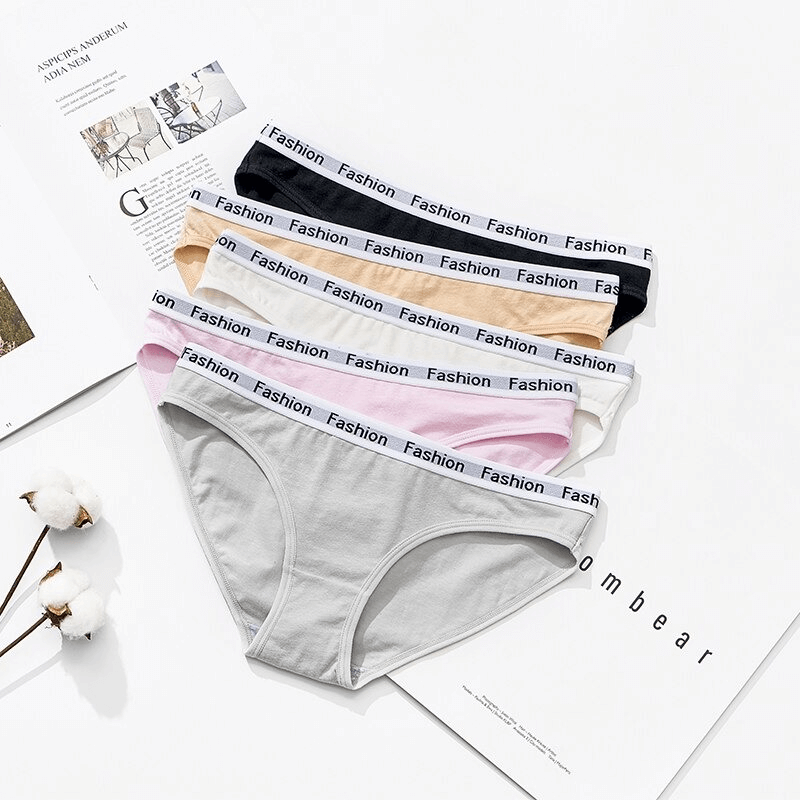 Five pairs of colorful women's cotton elastic waist briefs, showcasing black, white, pink, gray, and nude hues, perfect for sports and comfort.